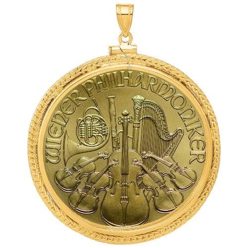 Austrian Gold Philharmonic coin pendant, one ounce .9999 fine gold, featuring orchestra instruments design, displayed in a decorative gold bezel.