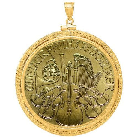 Austrian Gold Philharmonic coin pendant, one ounce .9999 fine gold, featuring orchestra instruments design, displayed in a decorative gold bezel.