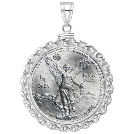 Mexican 1/4 Onza Silver Libertad coin pendant from 1984, .999 fine plata pura, featuring Winged Victory with volcanoes, set in a scalloped white gold bezel.