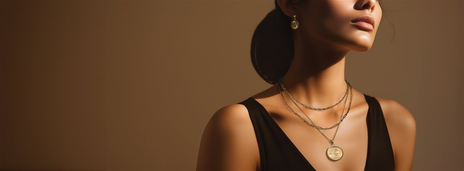Gold coin pendant styled on a chain